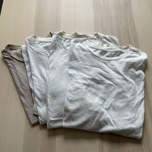 Four Patagonia regenerative cotton tees in birch white and brown